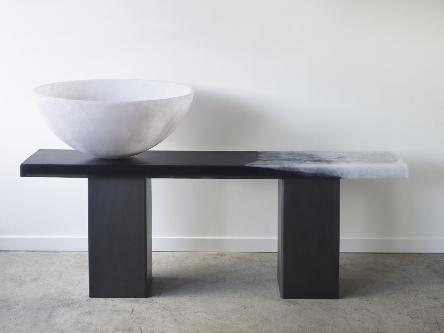columbia console table in black and white marble with white resin bowl