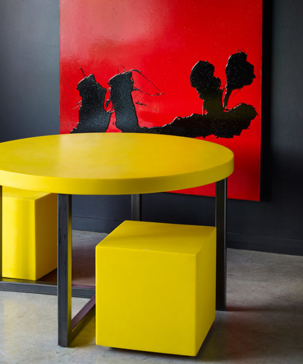 This round dining contemporary table is one of our signature pieces. It is loved for its clean, exciting, contemporary design. Customize the table by height or colour to make it your own. Shown in bright yellow with yeloow stools and a lovely red accent painting. Made to order and customizable at Studio Sturdy. Created by Martha Sturdy