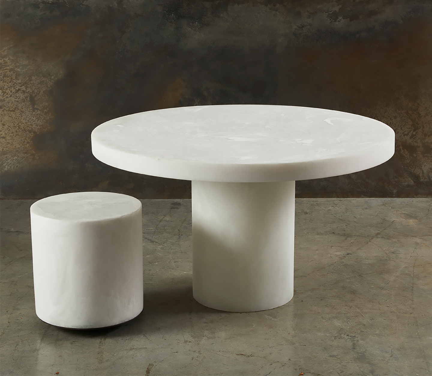 An intimate round resin dining table adds both class and simplicity and is a very popular furniture choice for interior designers. The height of this table can be customized to your preference. Available for sale at Studio Sturdy and created by Martha Sturdy