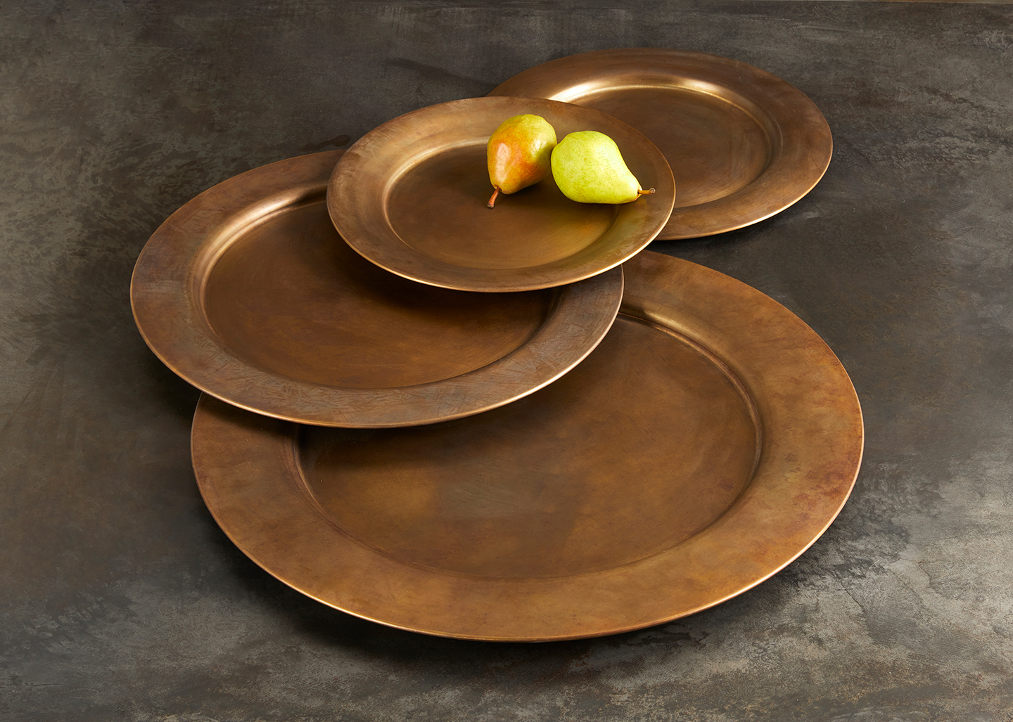 Elevate your room with these modern home decor accents, beautiful brass platters made with the best quality brass and finished with our Signature Evolving Patina. Use these pieces to serve cocktails or as a centrepiece base on a coffee or dining table. For sale at Studio Sturdy and created by Martha Sturdy