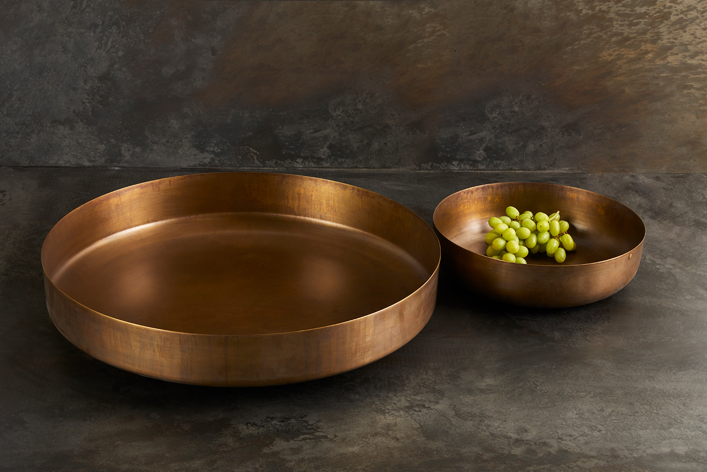 A modern room accessory. These stylish brass bowls are handcrafted from sheets of spun metal and finished with our signature evolving patina. Available for purchase at Studio Sturdy and created by Martha Sturdy