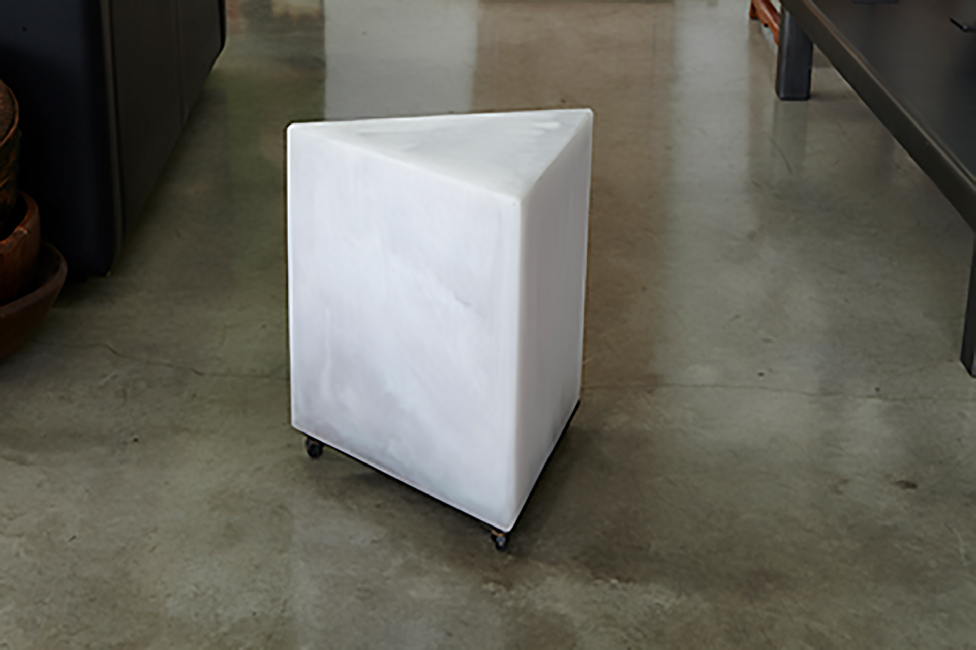 triangle stool in white resin made by Martha Sturdy and sold at Studio Sturdy