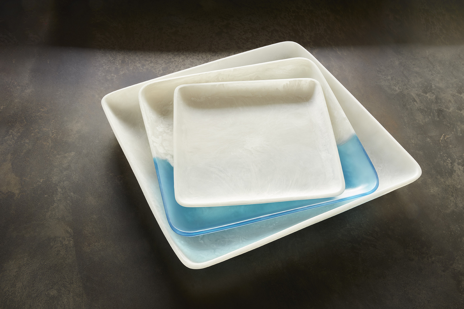 glacier square platter is a contemporary platter that is designed out of resin by Martha Sturdy and is the perfect option for interior designers looking to add something special to a home