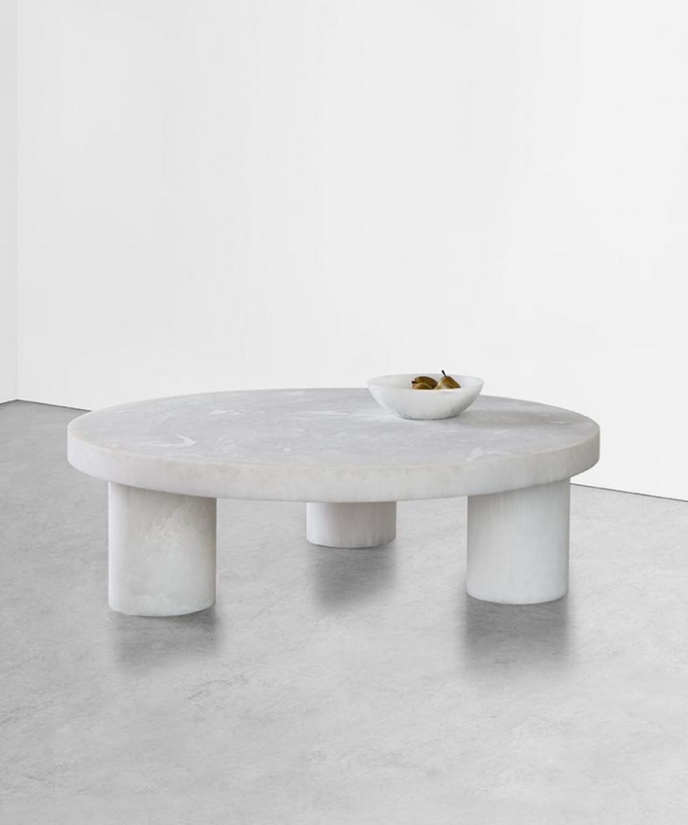 This stately large scale designer furniture round coffee table is striking and an instant classic. Available for purchase at Studio Sturdy and created by Martha Sturdy. Made out of resin and steel