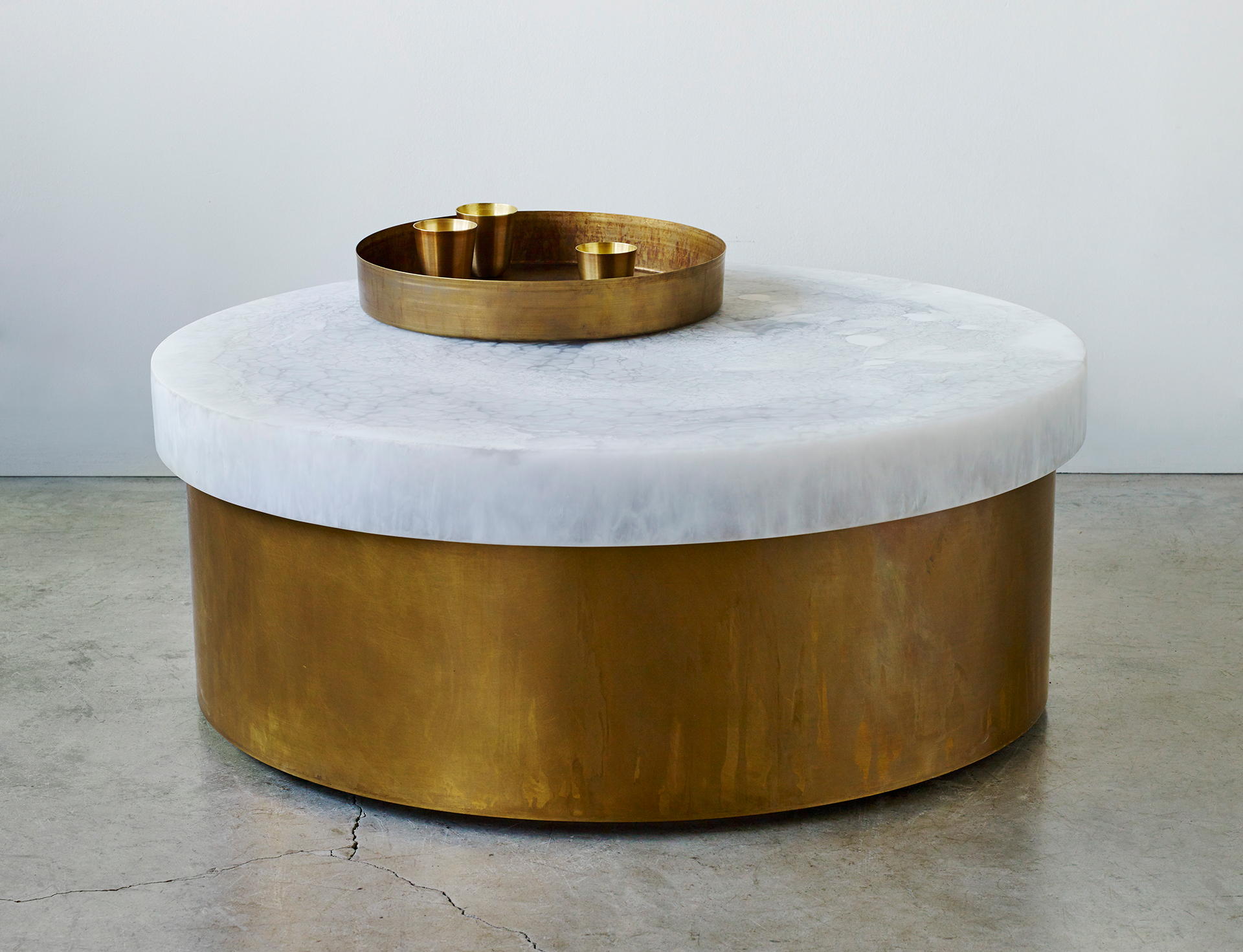 The Fusion small modern coffee table is made of resin and brass and is hand patinated in a stunning antique finish. Inquire for purchase at Studio Sturdy. Created by Martha Sturdy